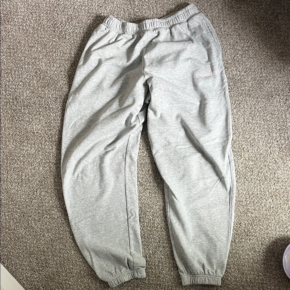 Light Gray gymshark Cozy Sweatpants with pink writing